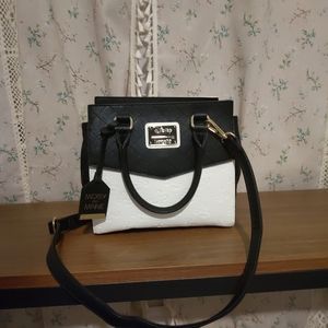 Loungefly Disney purse with embossed Mickey and Minnie mouse black and white